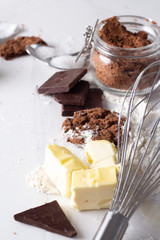 ingredients for chocolate chip cookies on white background close up.