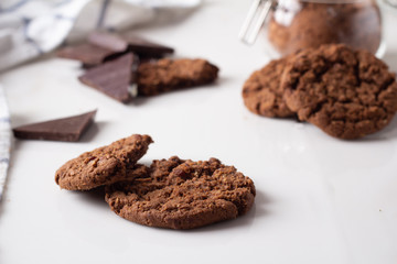 chocolate chip cookies. cocoa and dark chocolate on a white background close-up.