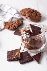 chocolate cookie.bank with cocoa and dark chocolate on a white background close-up.