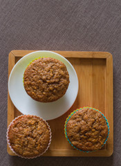 Tasty cupcakes on table in kitchen
