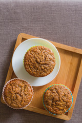 Tasty cupcakes on table in kitchen