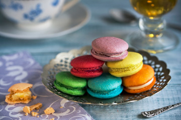 Tasty french macarons on a wooden table with vintage color tone, Macarons is a French sweet meringue-based