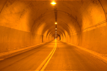 Highway tunnel road on yellow natural light