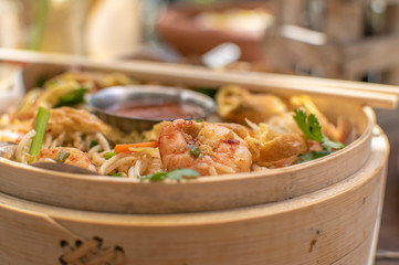 Selective focus of stir fried noodles with shrimps
