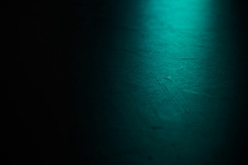 Black ballet hall floor on blue spotlight.Background for dance and theater.