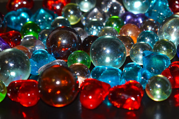 Fototapeta na wymiar Multi-colored shiny glass balls close-up.