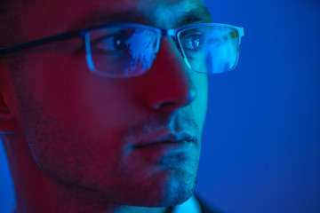 The portrait of the handsome man in glasses