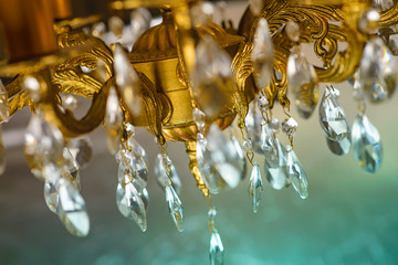 Crystal chandelier close-up. Gradient pastel background, sparkling background