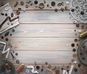 Retro sewing accessories and accessories for needlework. Reels of thread, pins, buttons, ribbons on...