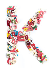 Colorful wood alphabet letters on white background,letter K
