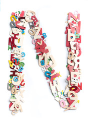 Colorful wood alphabet letters on white background,letter N