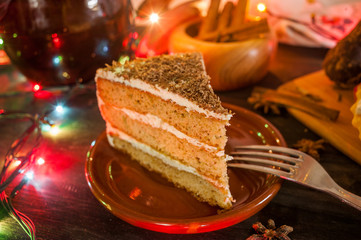 Christmas cake and decorations on table