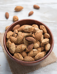 Almonds in a bowl on the wood table