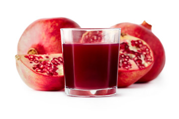 Fresh pomegranate juice in a glass isolated on white background
