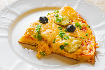 A slice of Pizza with olives. Hot delicious pizza with cheese, olives and green onions