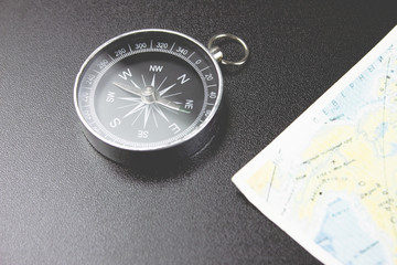 compass and map on the table