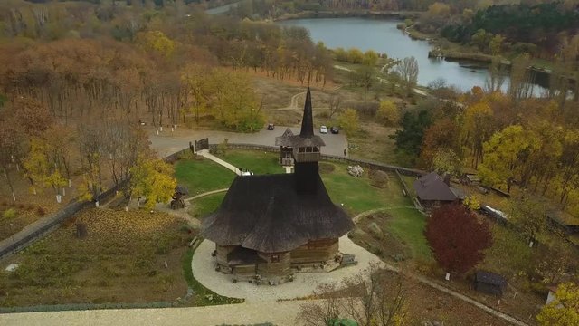 Flight over old wooden church at the periphery of Kishinev city, Moldova republic.