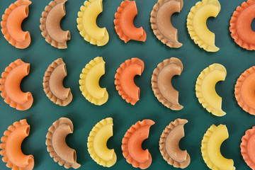 Pasta creste di gallo on green background