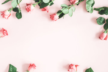 Flowers composition. Pink rose flowers on pastel pink background. Flat lay, top view, copy space