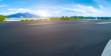 Empty asphalt road square and natural landscape under the blue sky