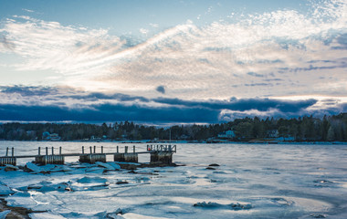 Fototapeta na wymiar Winter in Nova Scotia, sunset over lake in winter, cold, no people, landscapes, scenic.