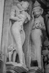 Stone carved erotic bas relief in Hindu temple in Khajuraho, India