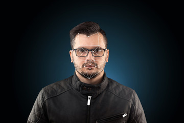 Obraz premium Male face, Biometric verification - face recognition. Technology of face recognition on polygonal grid is constructed by the points of IT security and protection. Face id, copy space