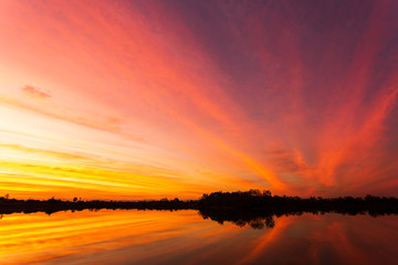 colorful dramatic sky with cloud at sunset.