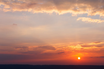colorful dramatic sky with cloud at sunset.