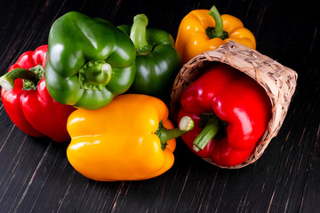 Three sweet peppers on a wooden background, Cooking vegetable salad