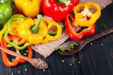 Three sweet peppers on a wooden background, Cooking vegetable salad