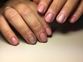 Fashionable gentle manicure with silver foil