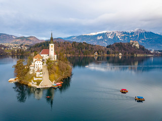 Lake Bled with its island and a church is the most notable as a popular tourist destination in...