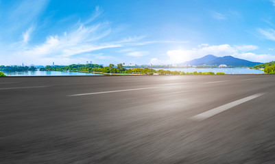 Empty asphalt road square and natural landscape under the blue sky