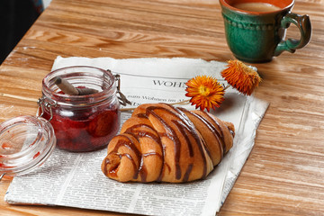 Fresh breakfast of croissants with chocolate syrup