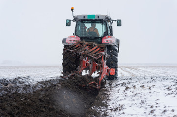Preparing land for sowing in snow