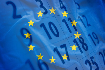 The flag of EU with calendar in the background