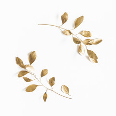 Eucalyptus leaves on white background. Wreath made of golden eucalyptus branches. Flat lay, top...