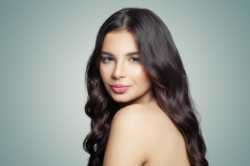 Naklejka premium Fashion beauty portrait of young woman. Female face on blue