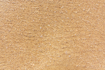 large Golden sand of the sea, the surface of the sea coast, texture, background