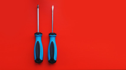 Screwdriver isolated on bright Background. Top View of Blue Handle Screwdriver