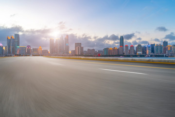 Empty asphalt road along modern commercial buildings in China,s cities