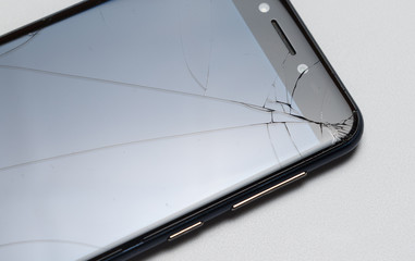 Close-up of phone or tablet with broken screen