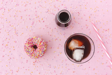 Donut, Cold Brew coffee in a Glass and Jar on Pink Background