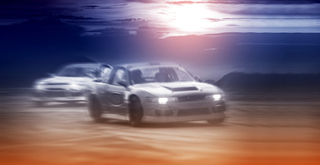 Fototapeta na wymiar Blurred two drifting cars battle on speed track, sport concept