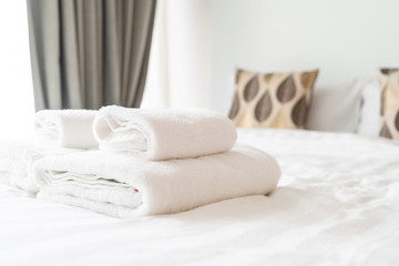 white towel decoration on bed