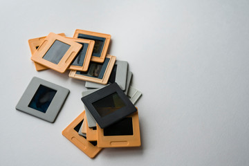 The collection of slides in frames on a white background. Selective focus. Copy space. - obrazy, fototapety, plakaty