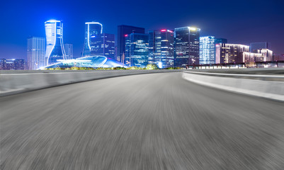 Road Pavement and Night View of Hangzhou Urban Architecture..