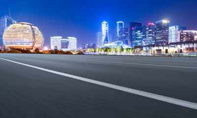 Obraz premium Road Pavement and Night View of Hangzhou Urban Architecture..