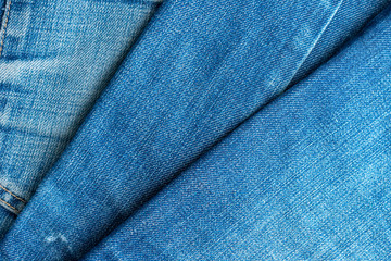 Naklejka premium Blue jeans pile. Denim Texture.